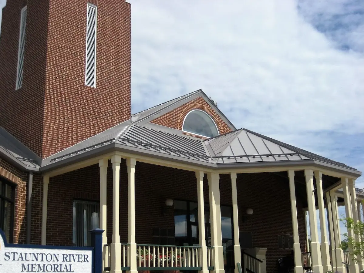 Skilled roofing craftsmen working on a residential roof in Trenton
